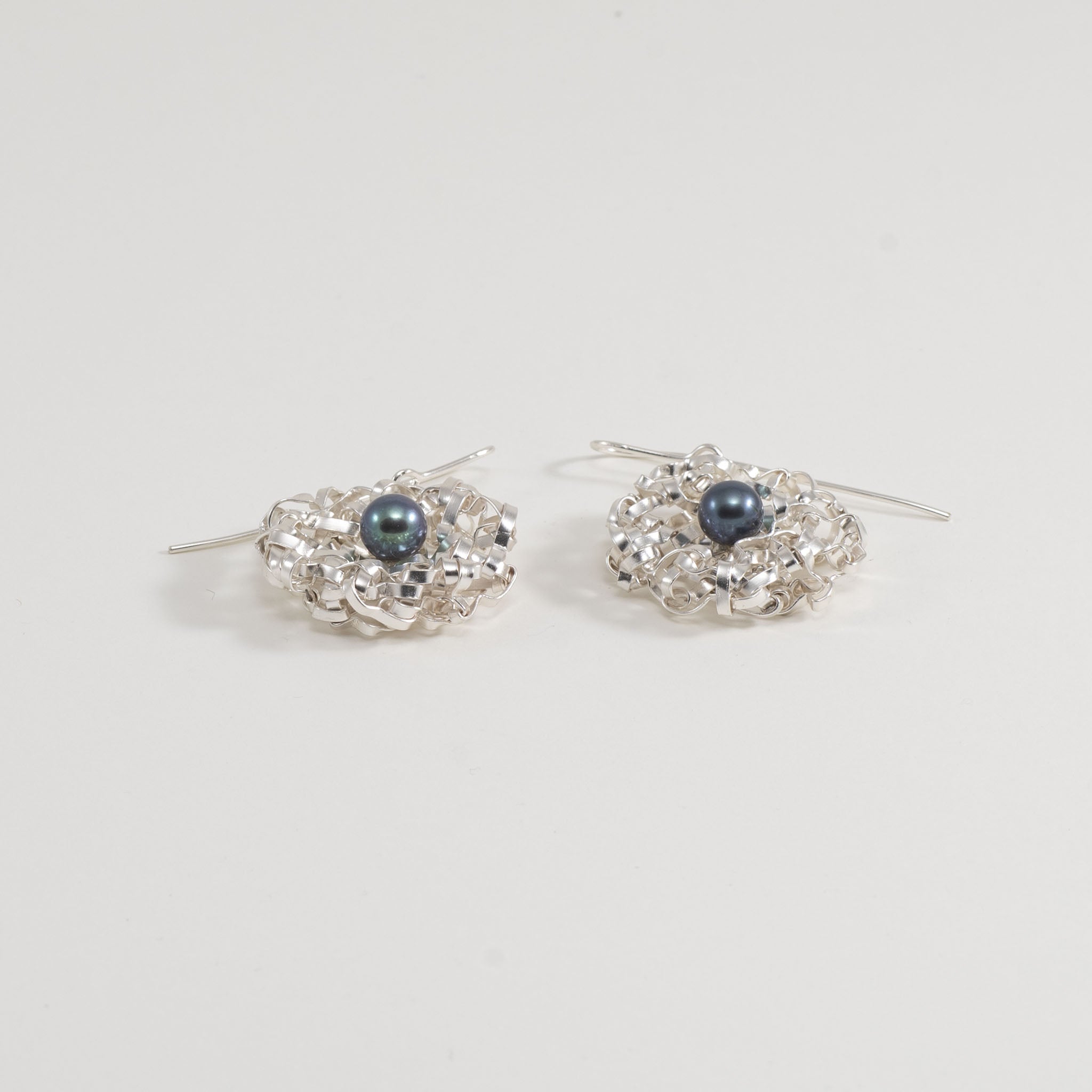 Orecchini a trama rotonda con perla